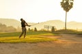 Golfer sport course golf ball fairway.ÃÂ  People lifestyle man playing game golf tee off on the green grass. Royalty Free Stock Photo